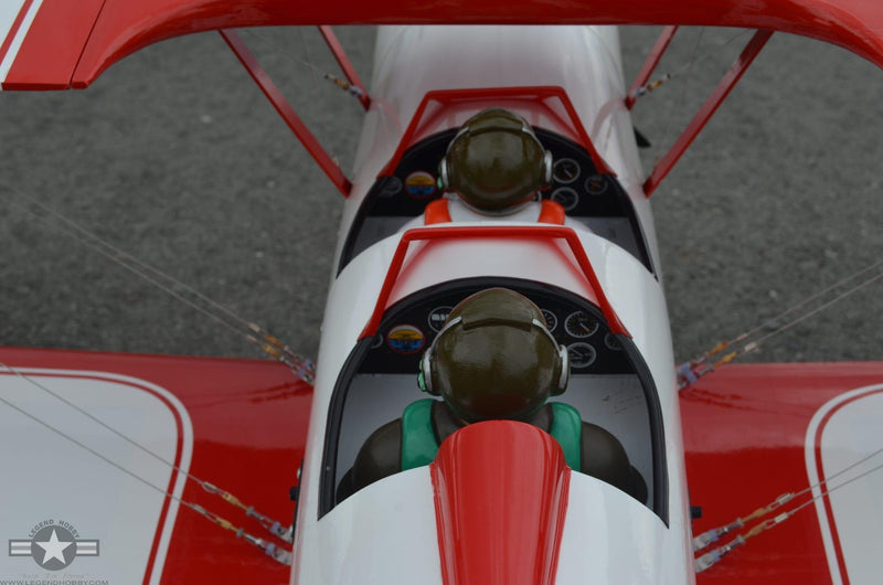 view ofpiltofigurines from the back of a red baron rc plane