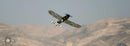 wide angle shot of JUNKERS CL1 G-BUYU 15cc flying in front of mountain range