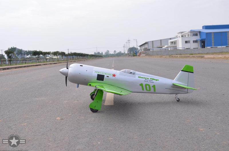 side view of Reno Air Care YAK-11 on a runway