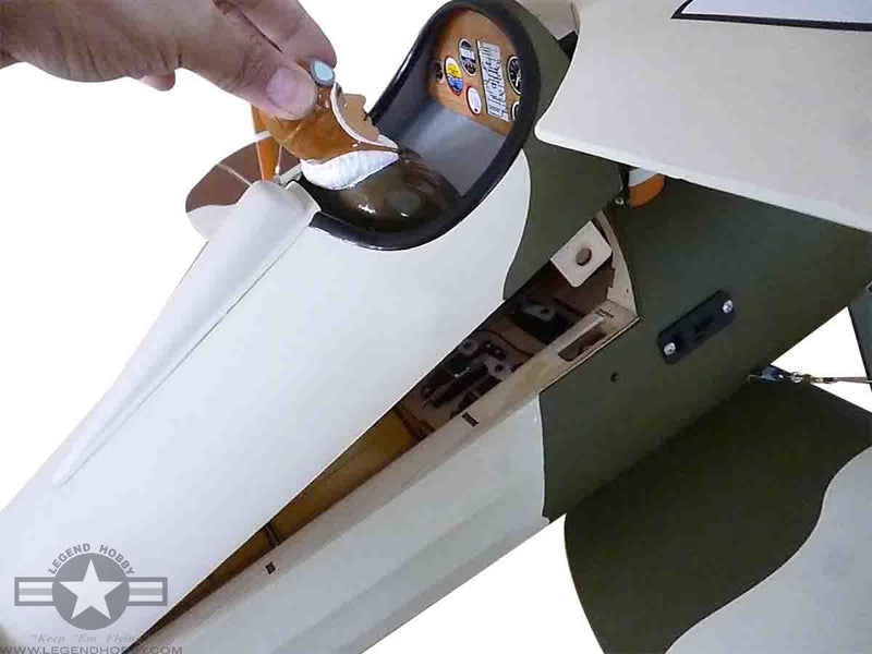 someone installing the cockpit of the Nieuport 28 Replica